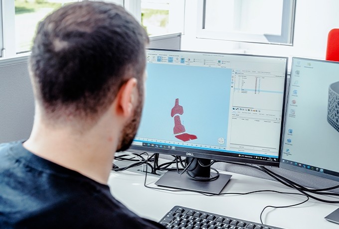 engineer working on digital files for 3d printed cushioning elements for Techart car seat